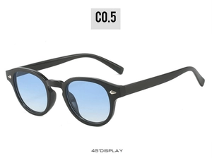 Detail view of round sunglasses with leopard print frame and blue gradient lenses