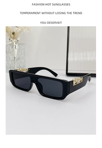 Detail of vintage rectangular sunglasses with gold panther metallic relief on the temple