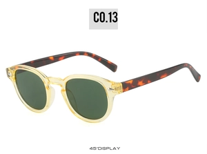 Detail view of round retro sunglasses with amber acetate frame and silver arrow rivets