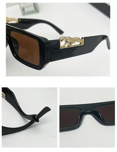 Detail of square sunglasses with gold leopard metal accent on temples and brown lenses