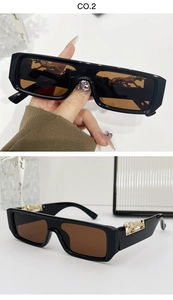 Macro detail of rectangle sunglasses with golden panther sculpture on the temples