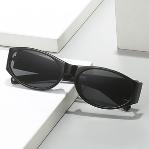 Classic black oval sunglasses with full-frame PC material on white geometric props