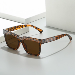 Oversized tortoise shell square sunglasses with rhinestone trim and brown lenses