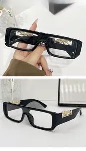 Close-up of retro square sunglasses featuring a gold leopard metal emblem on the frame