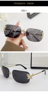 Detail of rimless sunglasses featuring golden metal butterfly and sparkling rhinestones