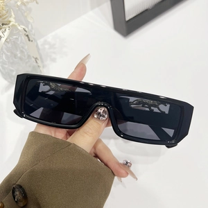 Retro square sunglasses featuring silver rhinestone leopard accents on black glossy frames