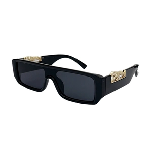 Vintage rectangle sunglasses with gold leopard temple accents and dark tinted lenses