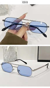 Detail of silver double bridge sunglasses with light blue lenses and metal frames