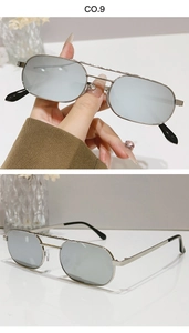 Detail of silver double bridge sunglasses with narrow rectangular frames and grey lenses