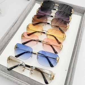 Frameless butterfly sunglasses set with gradient lenses and sparkling gold metal accents