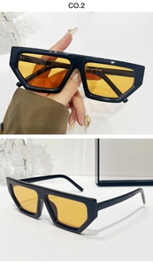 Detail view of retro black thick frame sunglasses with orange lenses and model specs