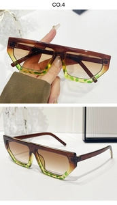 Close-up of geometric sunglasses with gradient frame and green leopard print details