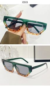 Detail of gradient olive green to tortoise shell sunglasses frame with gray lenses