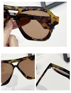 Detail view of tortoiseshell pilot sunglasses frame and premium metal hinge craftsmanship