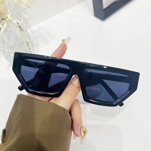 Women's black rectangular thick frame sunglasses with dark lenses for street style