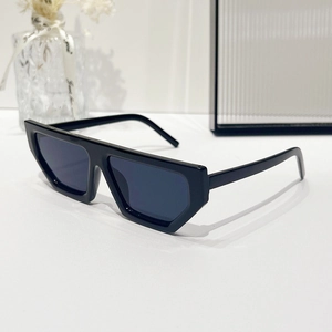 Modern black geometric rhombus sunglasses with thick frames on a minimalist white desk