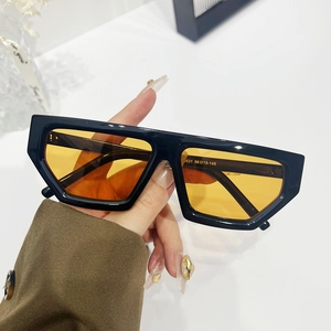 Fashionable small diamond frame sunglasses with black frames and orange lenses for women