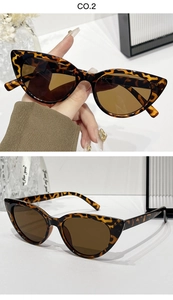 Close-up of leopard print cat eye sunglasses with brown lenses and slim temples