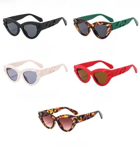 Detail view of cat-eye sunglasses featuring embossed wave patterns on the temples in five colors