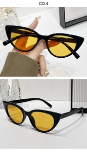 Close-up of cat-eye sunglasses with yellow lenses and frame specs 52-19-143
