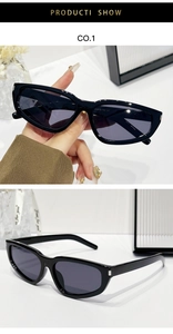 Detail view of rectangular cat-eye sunglasses with silver hinge and dark lenses