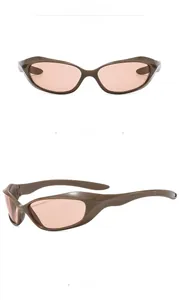 Macro detail of sporty Y2K punk sunglasses in coffee frame and tea pink polarized lenses