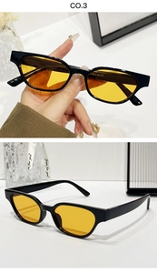 Détail des lunettes de soleil œil de chat vintage avec verres jaunes et monture noire