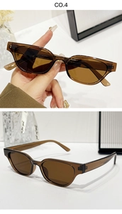 Détail de lunettes de soleil œil-de-chat ovales ambre montrant la texture et les mesures