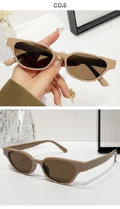 Détail de lunettes de soleil œil-de-chat nude avec monture en résine mate et verres bruns