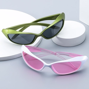 Retro Y2K punk cat eye sunglasses in green and white frames on a white platform