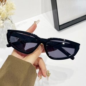 Retro black cat-eye sunglasses with dark grey lenses and 2024 trendy narrow frame