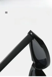 Detail showing the durable hinge and texture material of black narrow frame cat eye sunglasses
