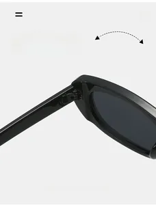 Macro detail of the durable metallic hinge on these sleek black narrow cat-eye sunglasses