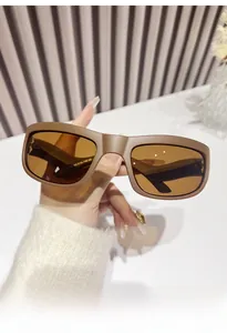 Detailed view of brown rectangle sports sunglasses with specific size laser engraving on frame