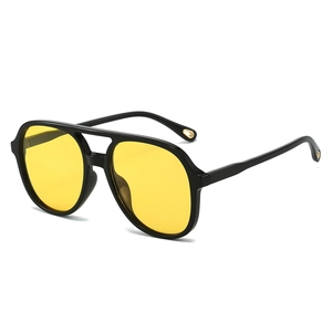 Classic pilot sunglasses with black double-bridge frame and yellow polarized lenses