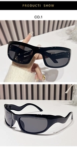 Detail view of Y2K futuristic sunglasses with wavy temples and dark grey lenses