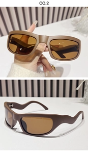 Macro detail of Y2K sporty sunglasses featuring brown matte frame and wavy temple arms
