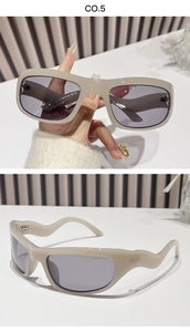 Detail of beige Y2K sports sunglasses featuring unique wavy temples and grey lenses