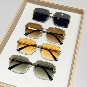 Frameless oversized square sunglasses with hand-set rhinestones and luxury metal bridge
