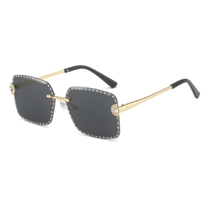 Frameless square sunglasses with grey lenses and sparkling rhinestone trim in gold metal