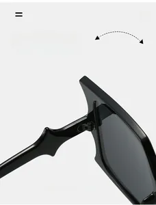 Detail of durable hinge on oversized square sunglasses with wave design temples