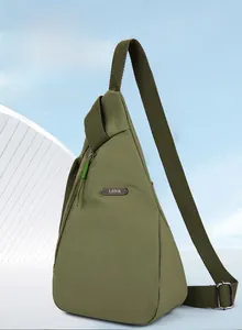 Detail of green waterproof nylon chest bag with adjustable strap and metal logo