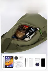 Detail view of military green nylon chest bag showing large capacity and internal compartments