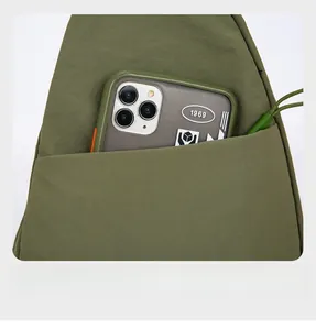 Detail of army green nylon chest bag featuring a secure back anti-theft zipper pocket