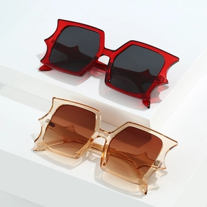 Fashionable oversized square sunglasses with wave edge frames in burgundy and champagne