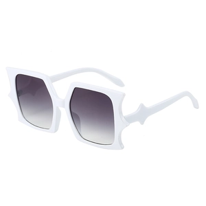 White jagged frame oversized sunglasses with grey gradient lenses and star decor