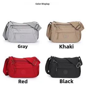 Color display of nylon crossbody bags in grey, khaki, red, and black with zip pockets