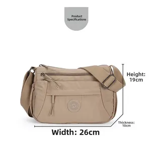 Detailed view of khaki nylon crossbody bag with dimensions 26cm width and 19cm height