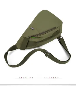 Detail view of military green nylon chest bag with metal zipper and adjustable strap