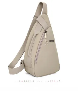 Detail view of triangular nylon crossbody chest bag with adjustable mesh shoulder strap